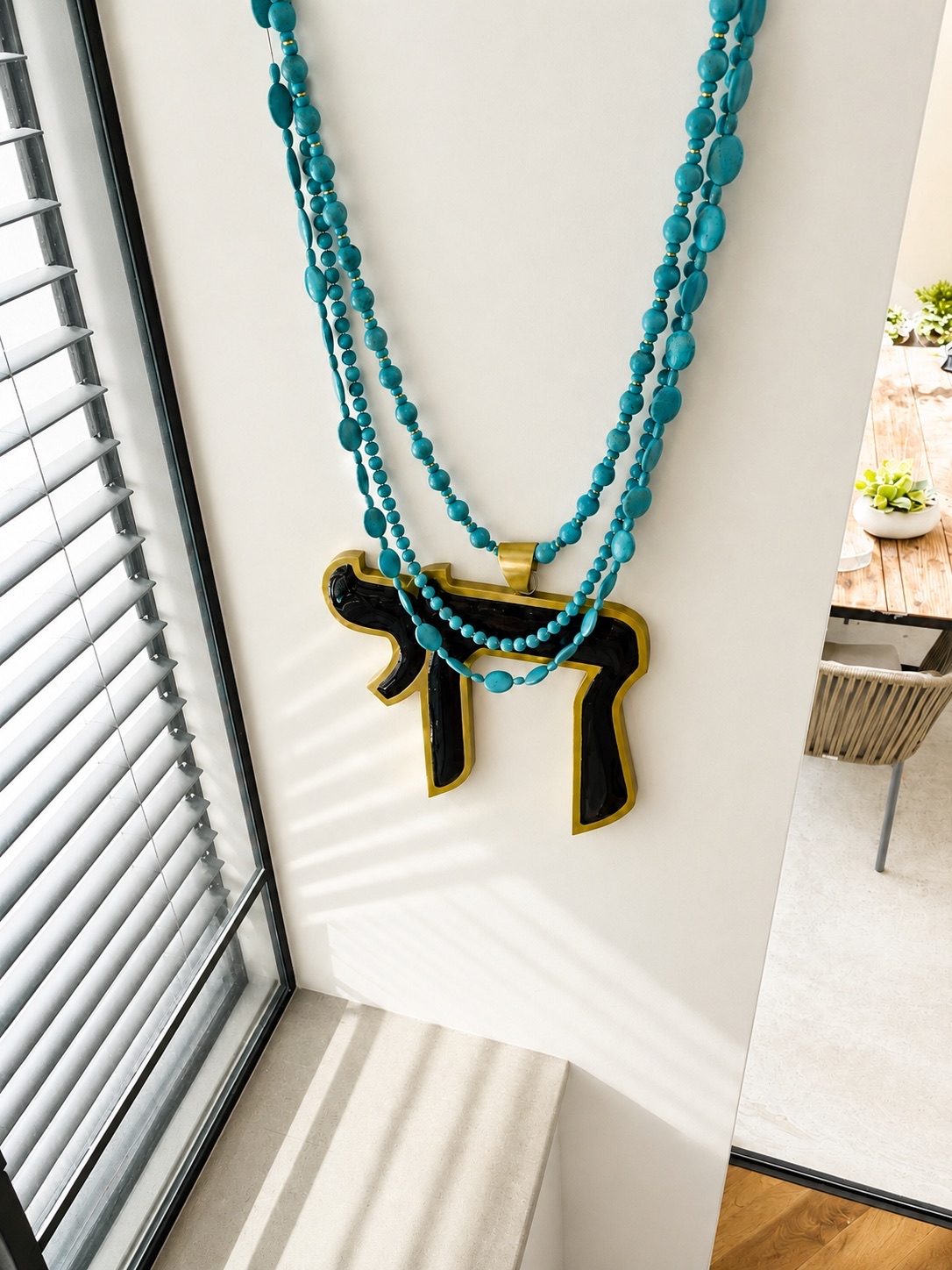 HAI wall necklace by Tali Veinrib, Home Jewelry wall sculpture in enamel and brass with turquoise beads, view 3